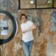 Social media influencer recording dynamic trending video content for TikTok and Instagram Reels using a ring light setup.